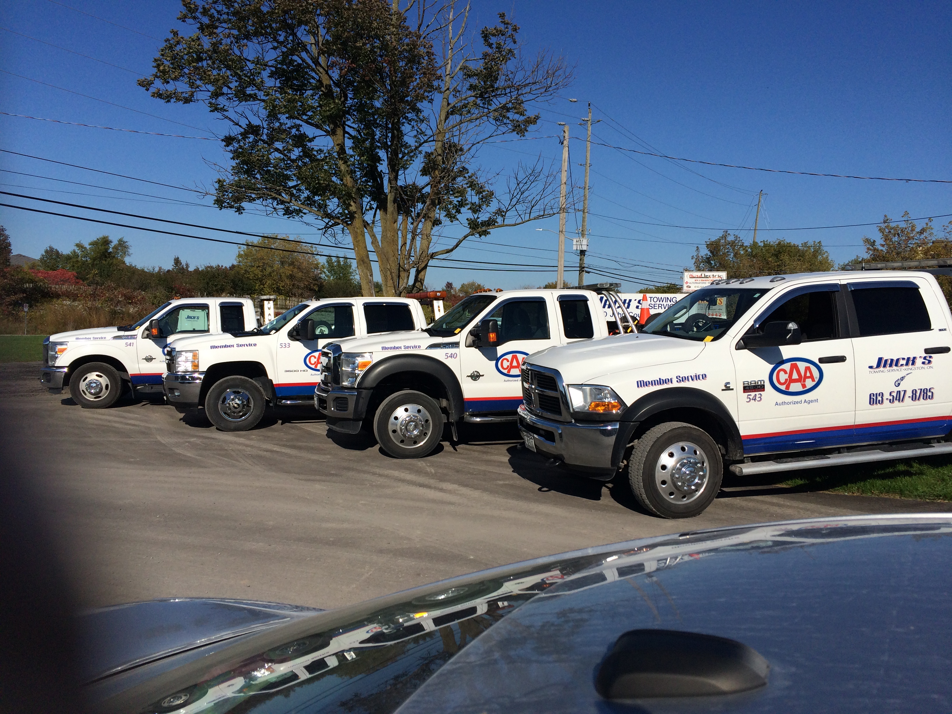 line-up of Jack's Towing vehicles at location